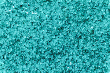 Turquoise sea salt background. Salted crystals close-up.