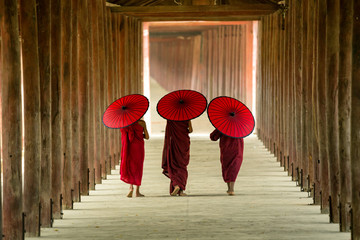 Myanmar Novice monks are walking in pagoda the temple salay Burma. - obrazy, fototapety, plakaty