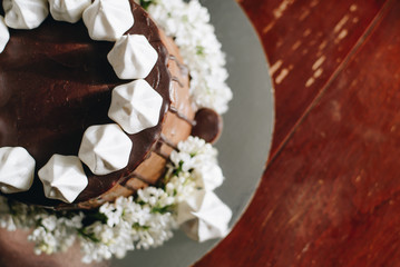 A home made cake covered by chocolate