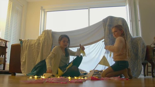 Sisters decorating fort