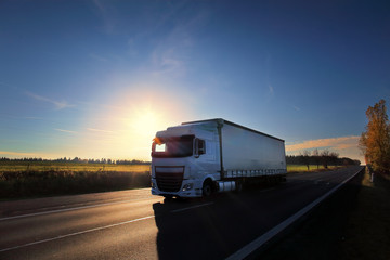 Fototapeta na wymiar Truck transportation at sunset