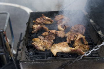 Thai style grilled pork Grill with smoke, street truck food shop, in Bangkok, Thailand