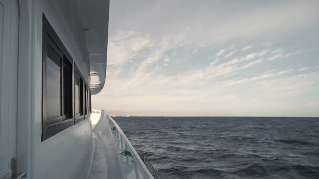 View from the side of moving boat on water of Red Sea