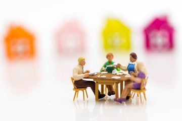 Miniature Families are celebrating , eating together happily. Used in the concept of family festival.