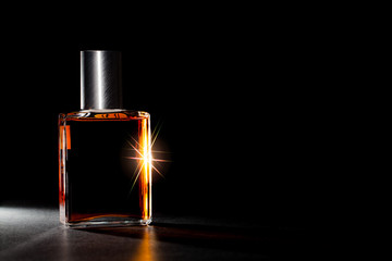 Luxury perfume bottle. Expensive fragrance in the spotlight.