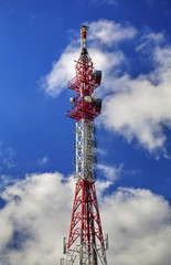 Communication antenna tower on blue sky