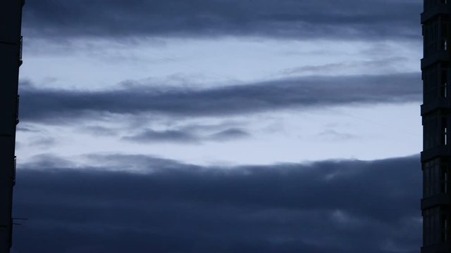 Movement of low dark gray clouds