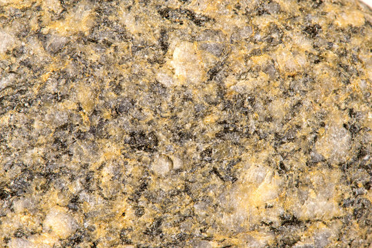 Granat mit Einsprenglingen von Feldspat und Biotit