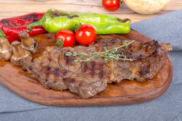 Grilled Steak Served on Wooden Plate