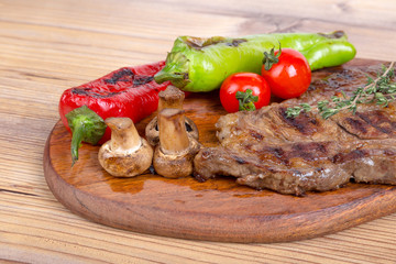 Grilled Steak Served on Wooden Plate
