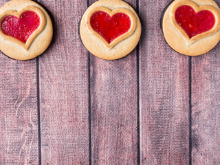 Homemade Cookies with a Red Jam Heart Valentine's Day Dark Wooden Background Copy Space