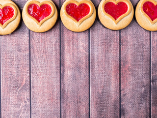 Homemade Cookies with a Red Jam Heart Valentine's Day Dark Wooden Background Copy Space