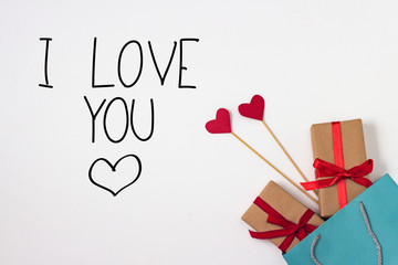 Hearts on stick, two gifts, gift bag on a white background. Added text I Love You