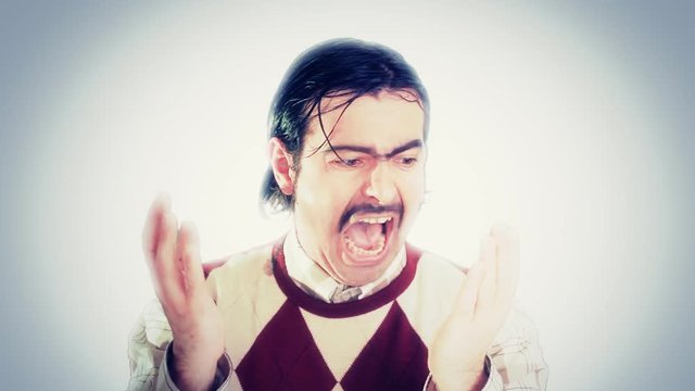 An ugly nerd looking scared, his hands are full of blood.
