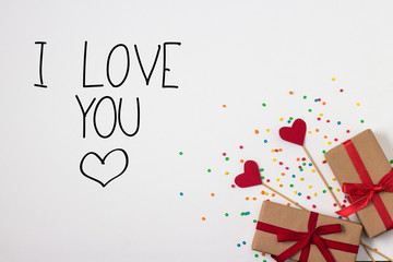 Hearts on Sticks, Two Gifts and Color Scenery on the White Background. Added text I Love You