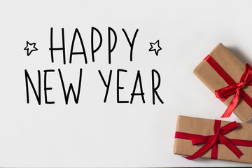 Two gifts on a white background. Added text Happy New Year