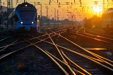 Zelfklevend Fotobehang Passenger train on rail track intersection © Yury Kirillov