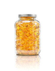 fish oil supplement capsule in clear glass bottle
