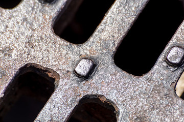 Close up of Metal grille of sewer, Pattern of square grate, Manhole drain cover in concrete road