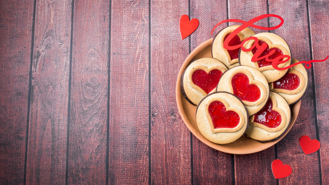 Homemade Cookies with a Red Jam Heart Valentine's Day Dark Wooden Background Copy Space