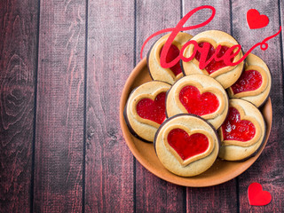 Homemade Cookies with a Red Jam Heart Valentine's Day Dark Wooden Background Copy Space