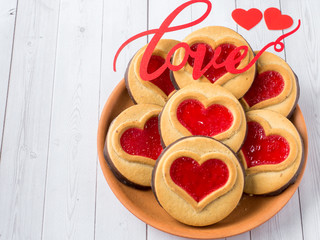 Homemade Cookies with a Red Jam Heart Valentine's Day White Wooden Background Copy Space