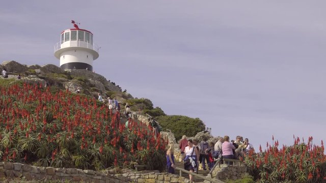 Tourists vist the Cape of Good Hope lighthouse