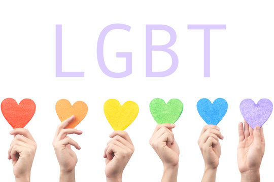 the LGBT community concept. Hearts rainbow colors in the hands, and the inscription
