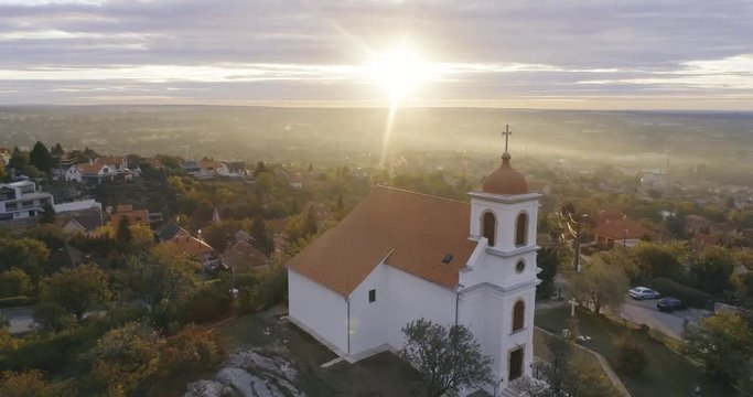 flying over a white church