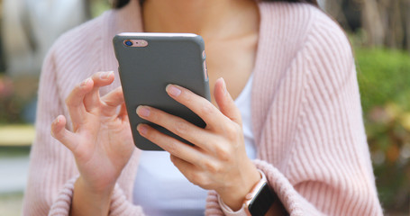 Using smart phone at the street