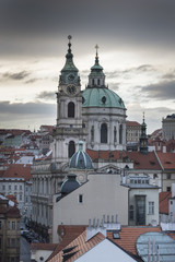 Fototapeta na wymiar St. Nicholas Church viewed from Lesser Town Bridge Tower, Lesser Town, Prague, Czech Republic