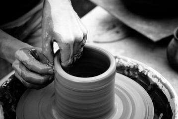 Hands working on clay
