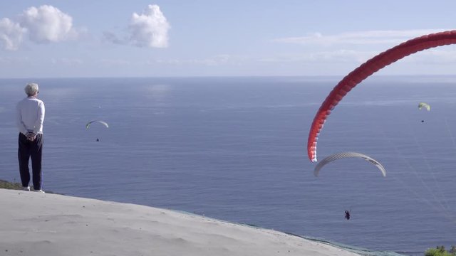 Para glider launching into winds over Cape Town