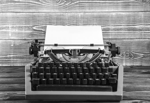 vintage typewriter on the background of a wooden table