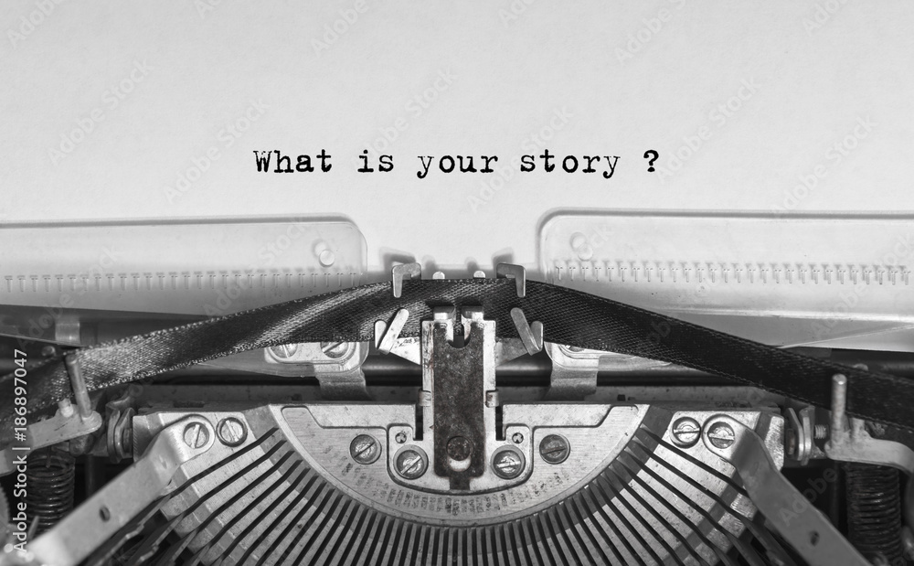 Wall mural What is your story typed words on a Vintage Typewriter - Wall murals