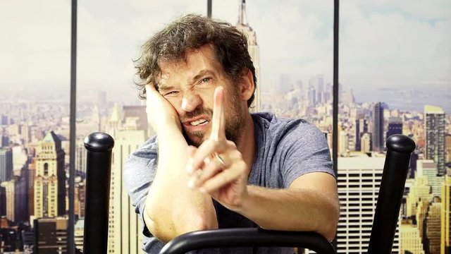 Man in gym exhausted and tired funny expression begging trainer to stop closeup