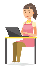 Fototapeta na wymiar A female home helper wearing an apron is operating a laptop computer