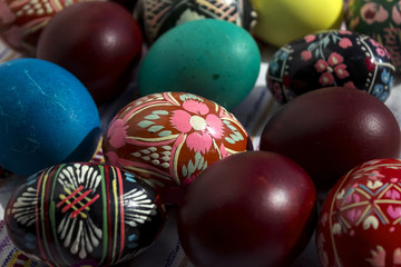 Fototapeta na wymiar Painted eggs for Easter, Ukrainian Easter eggs and Easter eggs on the embroidered towel