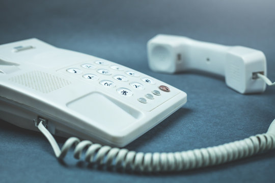 Office phone on a blue background.