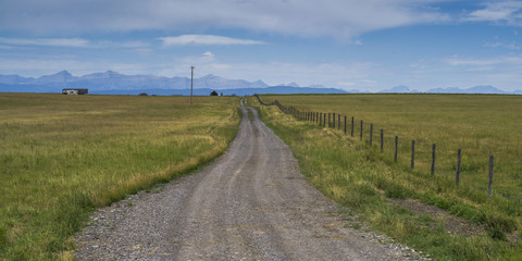 Fototapeta na wymiar Dirt road passing through landscape, Longview, Cowboy Trail, Southern Alberta, Alberta, Canada