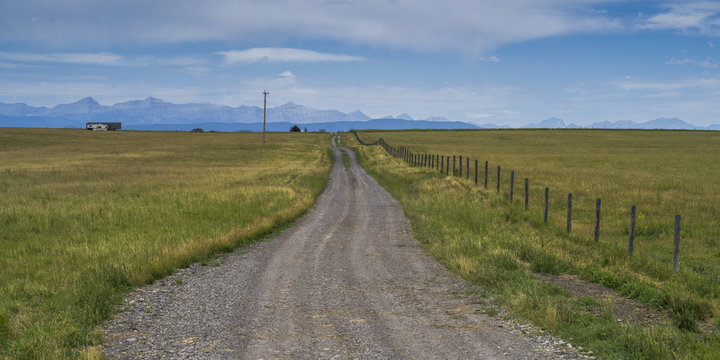 Dirt road passing through landscape, Longview, Cowboy Trail, Southern Alberta, Alberta, Canada