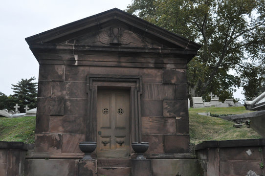 Old Stone Mausoleum In A Cemetery
