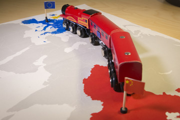 Toy train connecting Europa and China. Symbolizing the New Silk Road or one belt one road Chinese...