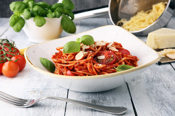 Italian pasta tomato Bolognese, fresh vegetables cuisine with basil