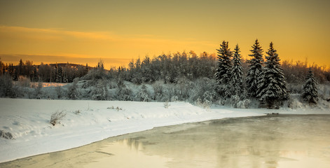 Alaska winter sunset on misty, frozen river