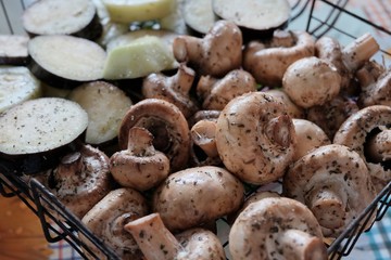 Fresh vegetables with seasoning ready to be grilled at outdoor party