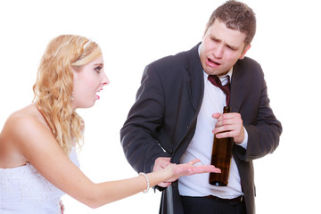 Bride having argument with drunk alcoholic groom