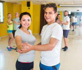 People are dancing waltz in pairs