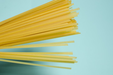 A stack of spaghetti in raw form on a light background