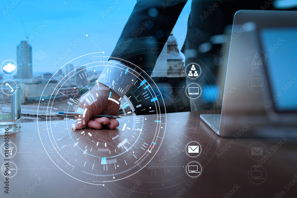 Poster target focus on businessman hand working with modern laptop computer in modern office with virtual i